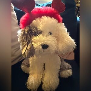 Source Unknown Fluffy Dog with Red Heart Antlers